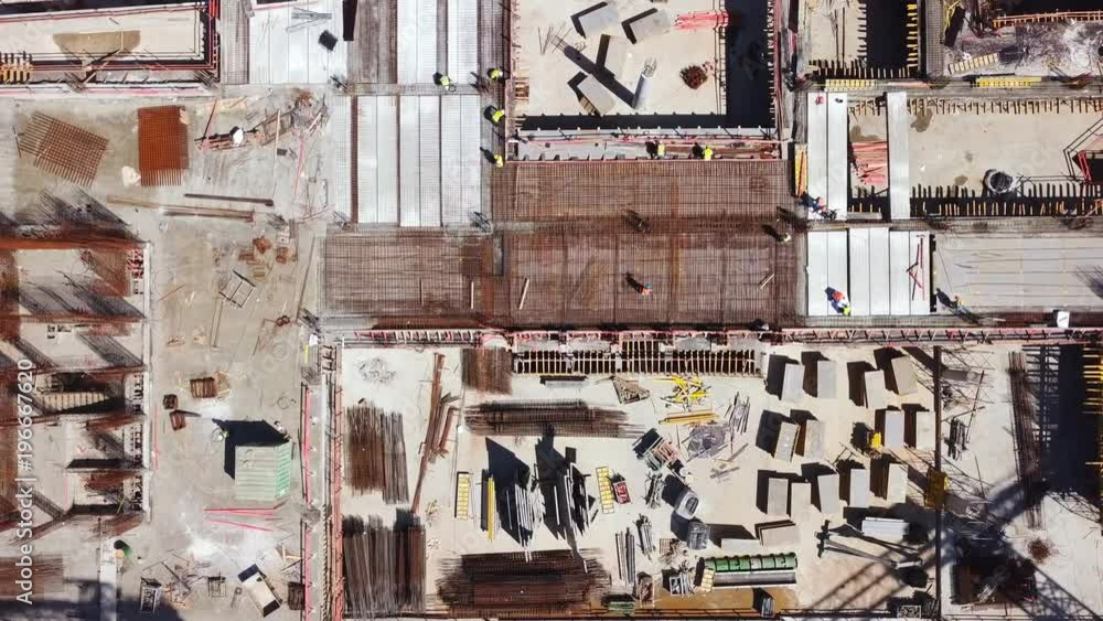 Construction site during work hours - Top down aerial footage Construction site during work hours - Top down aerial footage