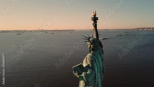 Statue of Liberty aerial circling monument over water with horizon in distance in 4K and 1080 HD