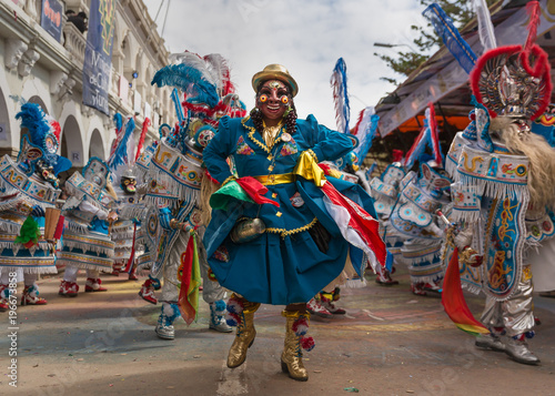 Fototapeta Oruro carnival in Bolivia with masked dancer during procession
