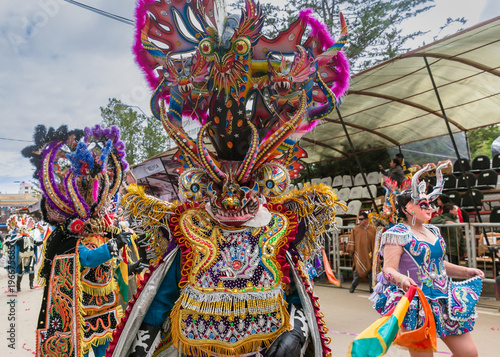 Fényképezés Oruro carnival in Bolivia with masked dancer during procession