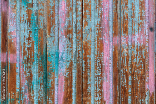 background of wooden boards with old shabby pink and blue paint