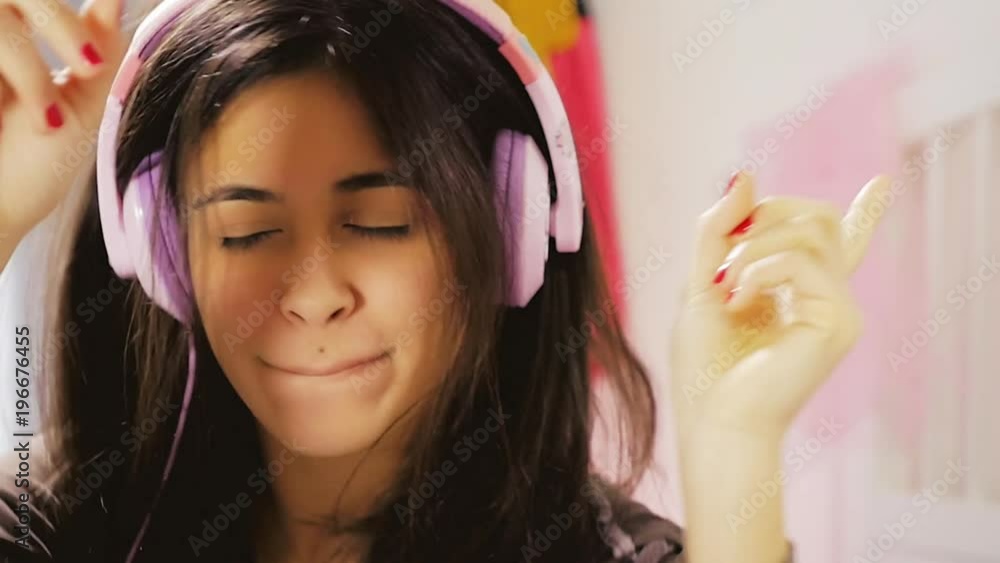 Cute happy young woman singing with headset slow motion closeup Cute happy young woman singing with headset slow motion closeup