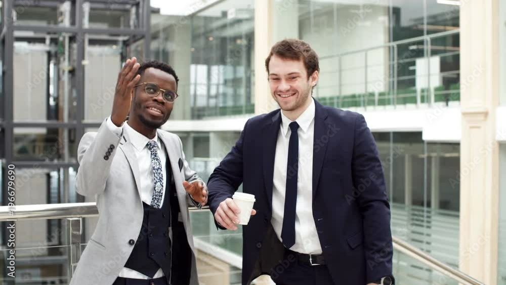 Afroamerican estate agent with potential client inside an empty office space. Afroamerican estate agent with potential client inside an empty office space.