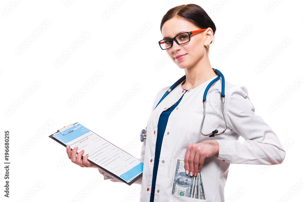 Young beautiful female doctor holding clipboard and money in her hands on white background accepting bribe concept Young beautiful female doctor holding clipboard and money in her hands on white background accepting bribe concept