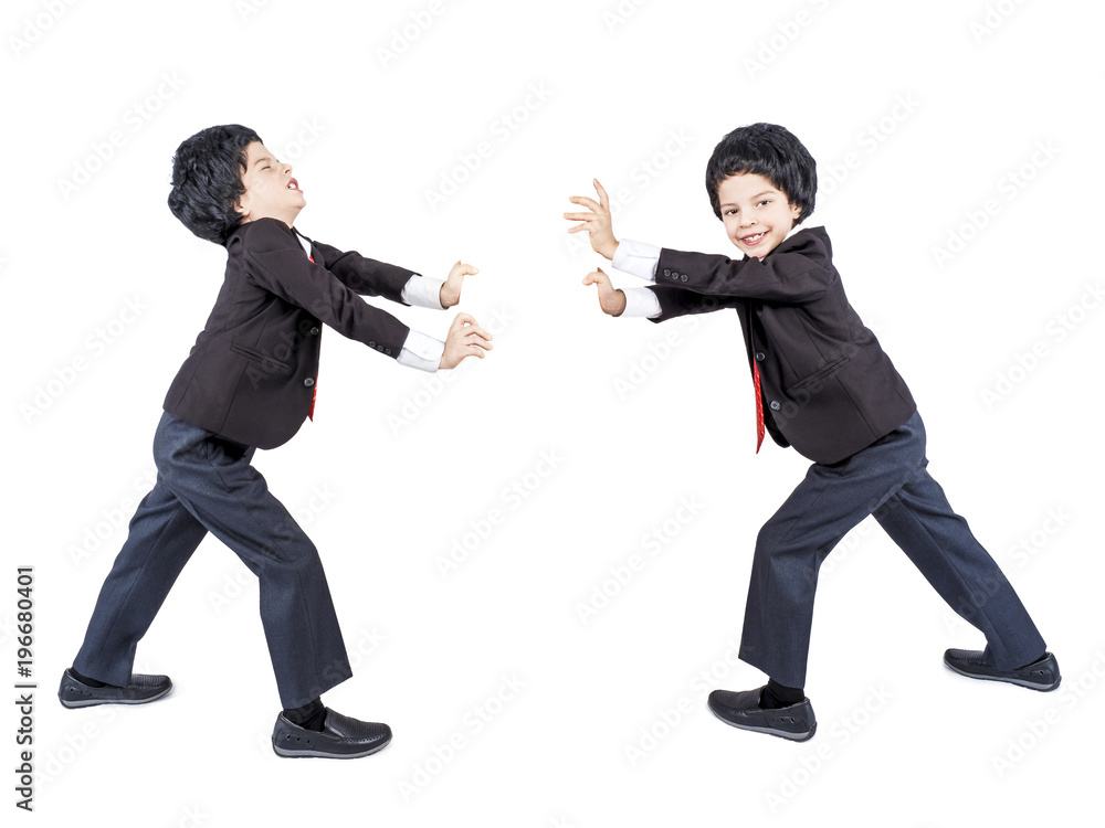 A young businessman pushes an imaginary wall. Isolated. White background. A young businessman pushes an imaginary wall. Isolated. White background.