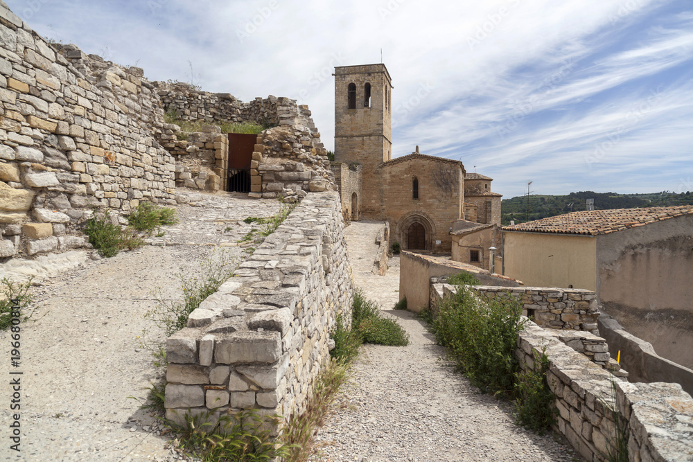  Village street view, ancient buildings and church, medieval village of Guimera, Province Lleida, Catalonia, Spain.