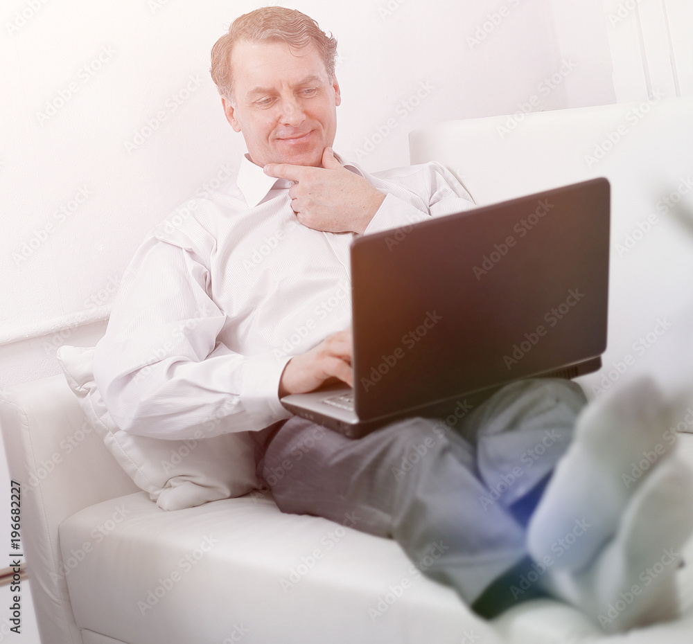 businessman with laptop works in the room businessman with laptop works in the room