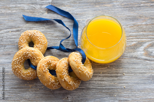 Traditional Greek Easter biscuits with sesame seeds on a wooden table. Delicious homemade pastries photo