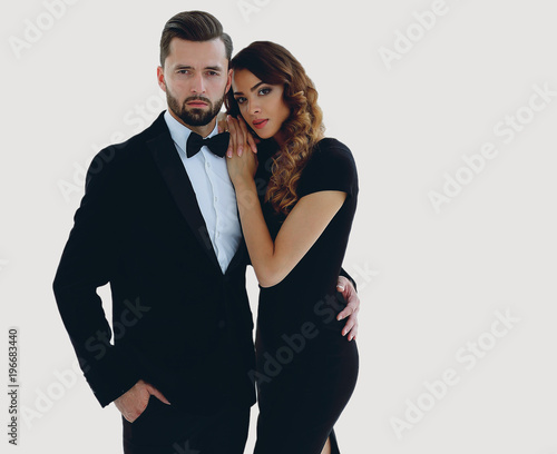 Fotografie portrait of an elegant woman in a black dress hugging her lover