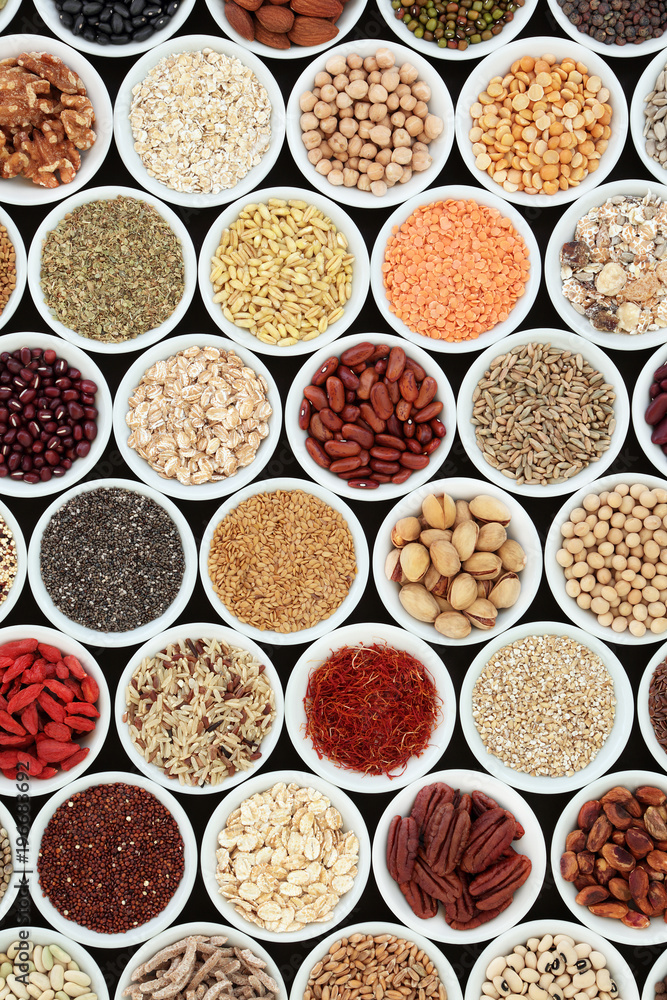 Dried high fibre health food with cereals, nuts, seeds, grain, fruit, spice and legumes with foods high in omega 3 fatty acid, antioxidants and vitamins, top view.