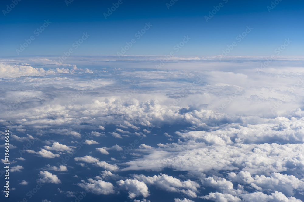 Beautiful view from window of airplane in blue sky