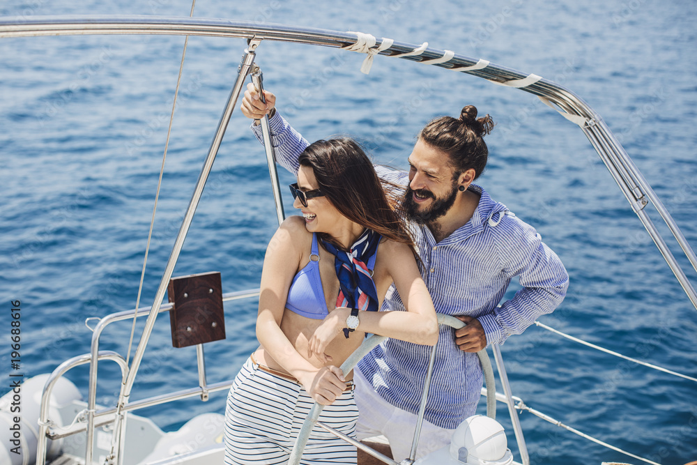 Couple Enjoying Summertime on Yacht Couple Enjoying Summertime on Yacht