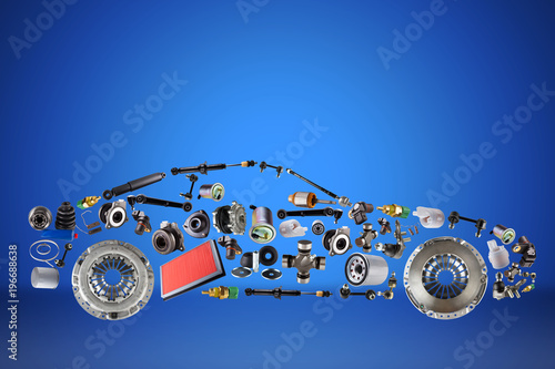 Passenger car assembled from new spare auto parts for shop aftermarket. Isolated on blue background.