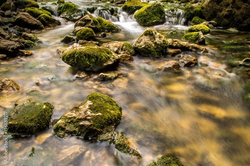 Fototapeta Naklejka Na Ścianę i Meble -  Mountain river with cascade and huge rocks