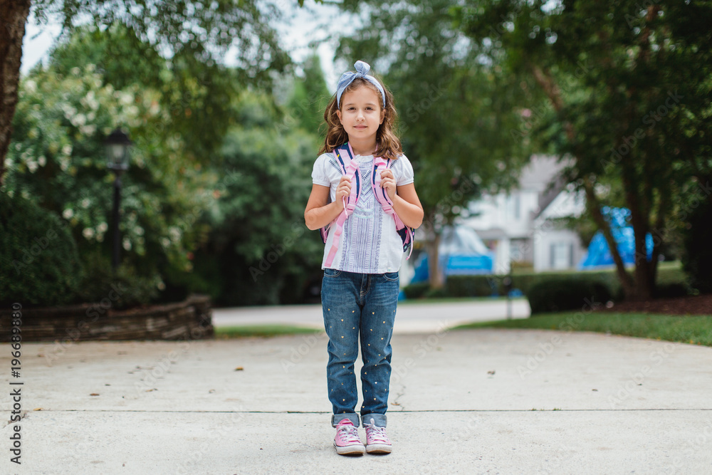 Portrait of a cute young girl wearing a backpack Portrait of a cute young girl wearing a backpack
