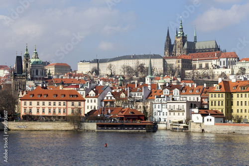 Early Spring Prague gothic Castle with the Lesser Town above River Vltava in the sunny Day, Czech Republic