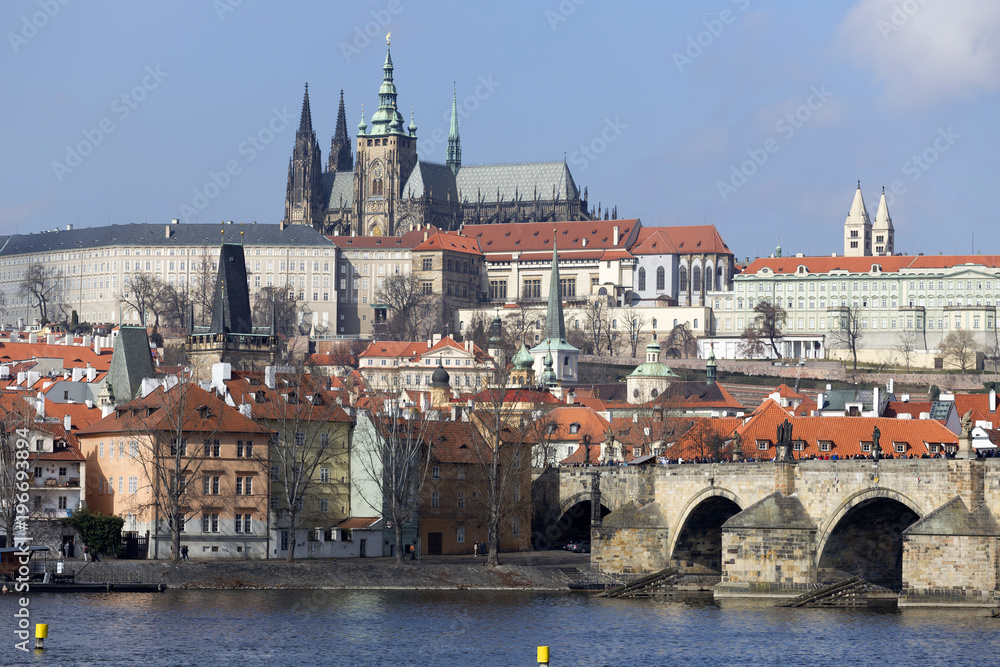 Early Spring Prague gothic Castle and Charles Bridge with the Lesser Town in the sunny Day, Czech Republic