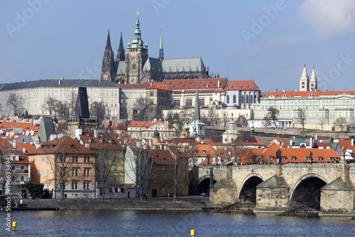 Early Spring Prague gothic Castle and Charles Bridge with the Lesser Town in the sunny Day, Czech Republic