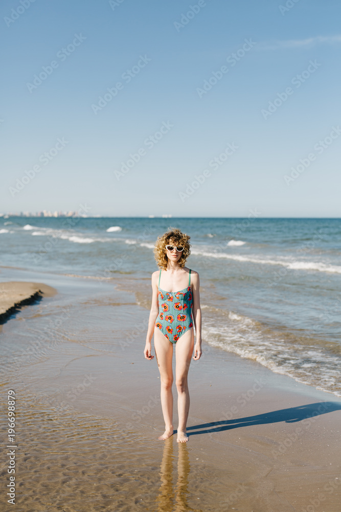 Woman standing at ocean Woman standing at ocean