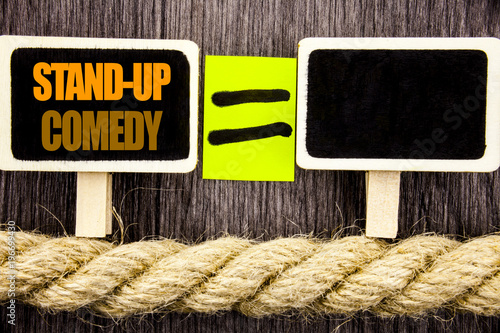 Ttext showing Stand Up Comedy. Business concept for Entertainment Club Fun Show Comedian Night written Blackboard Equatispace for your text the wooden background. photo