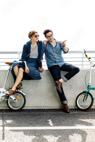 Cheerful couple spending time with bicycles photo