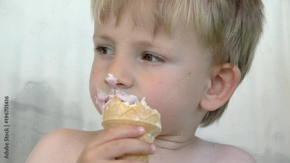 Portrait of happy child enjoy eating ice cream, amusing toddler Portrait of happy child enjoy eating ice cream, amusing toddler