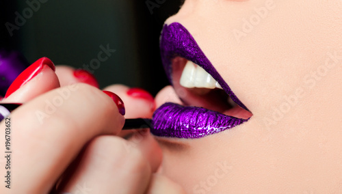 close-up of fashion womanish violet lips