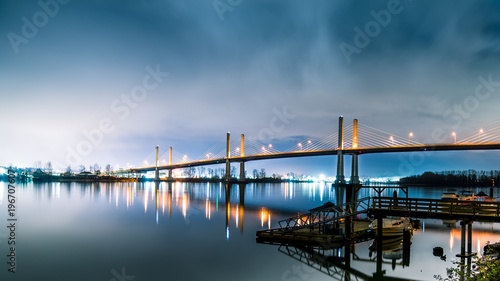 The Golden Ears Bridge, conecting Maple Ridge to Langley. Long exposure at night, reflecting into Fraser River. photo