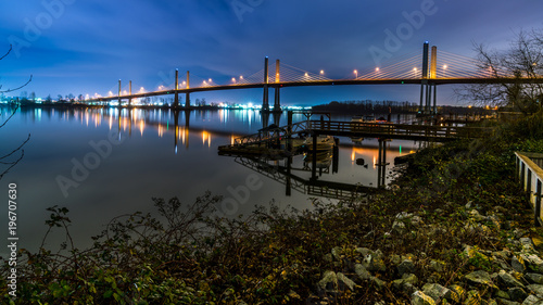 The Golden Ears Bridge  conecting Maple Ridge to Langley. Long exposure at night  reflecting into Fraser River.