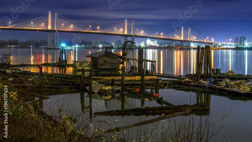 The Golden Ears Bridge, conecting Maple Ridge to Langley. Long exposure at night, reflecting into Fraser River. photo