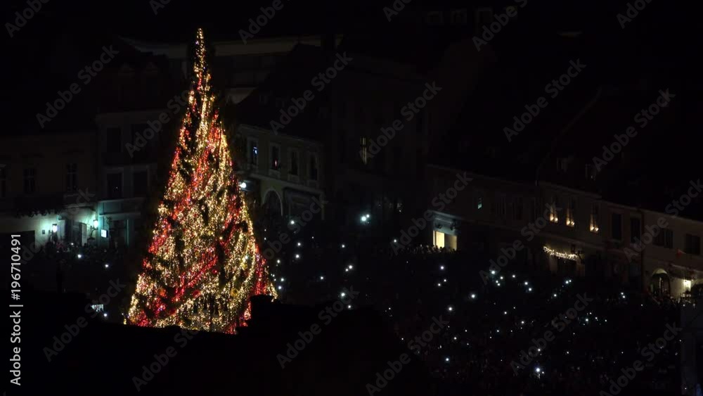 Sparkle Christmas fire tree outdoor, lights sparkling in the dark city