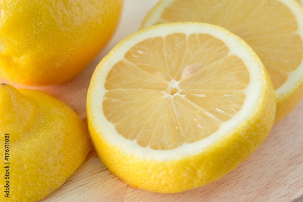 Lemons on a wooden plate Lemons on a wooden plate