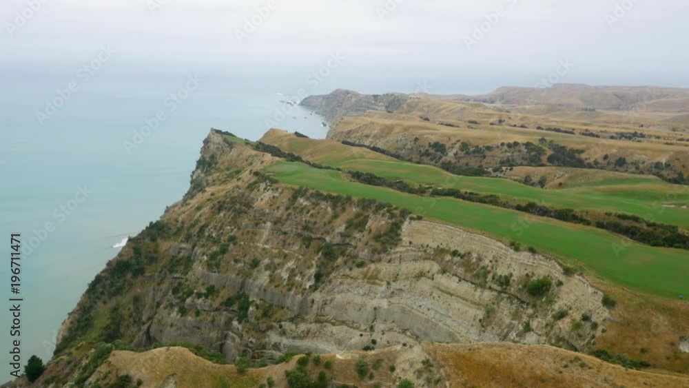 Aerial wide shot of a cliffside golf course on the coast of New Zealand. Aerial wide shot of a cliffside golf course on the coast of New Zealand.