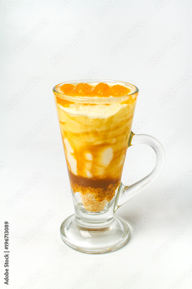 Desserts, A cup of yogurt and orange sauce with beans on white background Desserts, A cup of yogurt and orange sauce with beans on white background