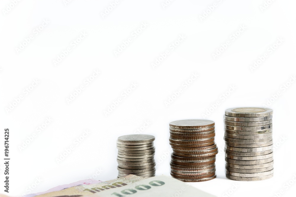 The silver coins placed in a row properly and bill placed in front on white background The silver coins placed in a row properly and bill placed in front on white background