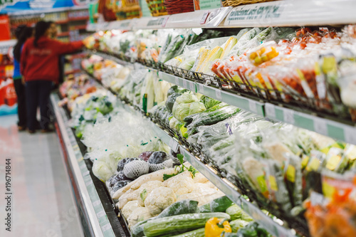 Fresh vegetables and fruits on shelf in supermarket