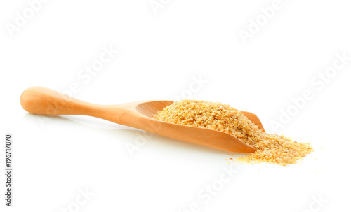 Wheat germ in wood scoop isolated on white background
