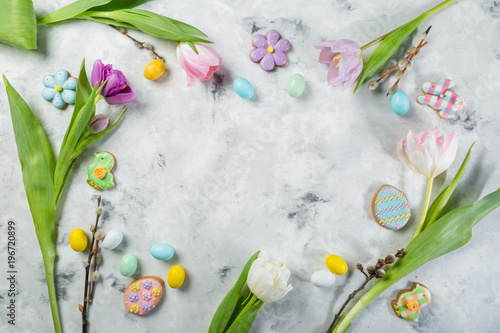 Easter concept - cookies with flowers on marble background