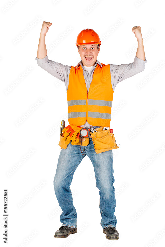 builder in a helmet looking at camera over white wall background. repair, construction, building, people and maintenance concept.