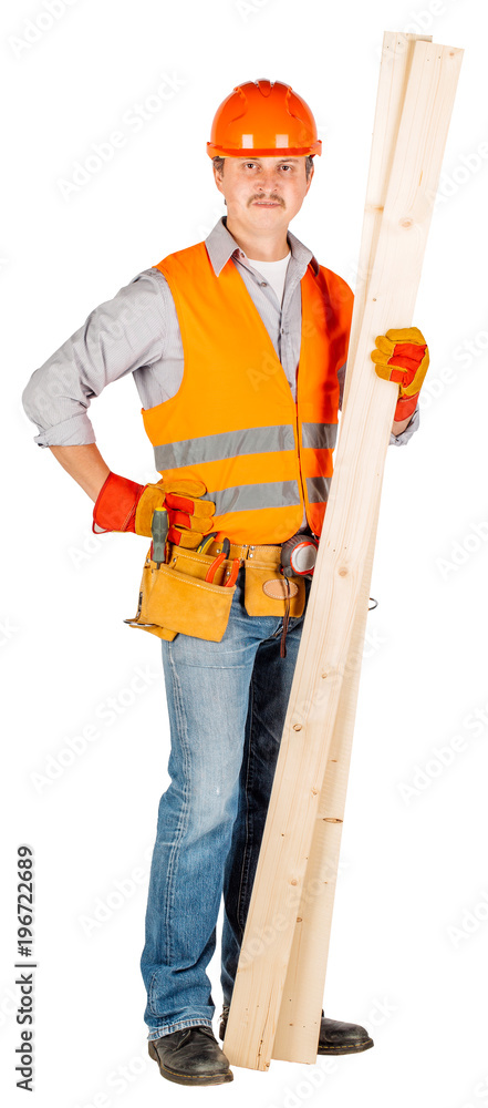 builder in a helmet holding wood boards builder in a helmet holding wood boards