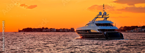 Yachtig on open sea at golden sunset panoramic view © xbrchx
