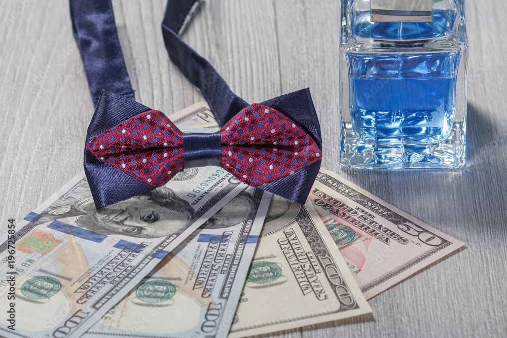 Fototapeta premium Man perfume, bow tie and dollar bills