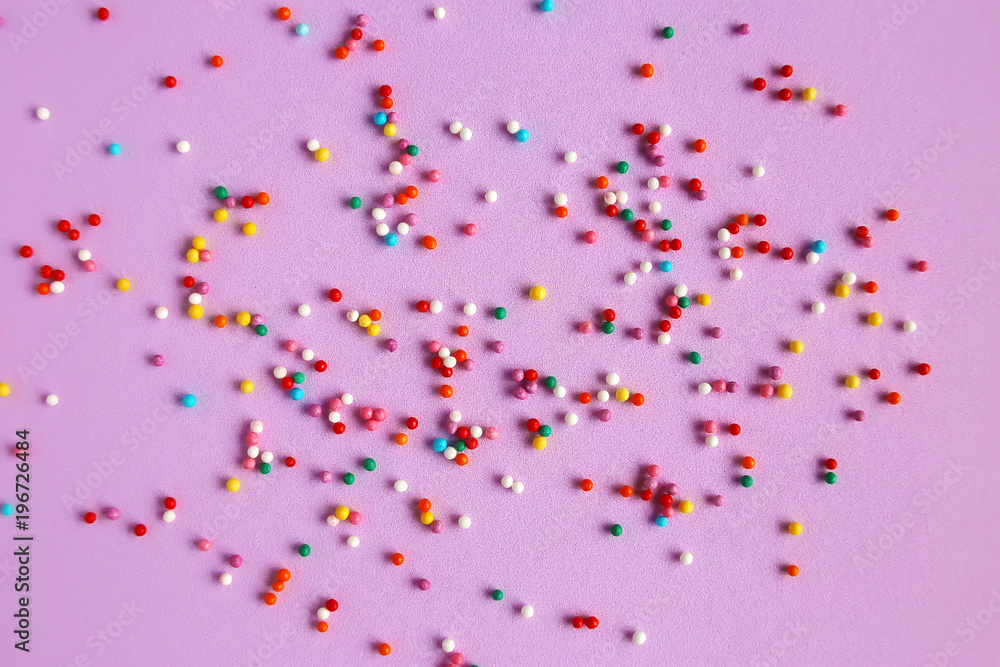 Texture background of pink color with sweet confetti
