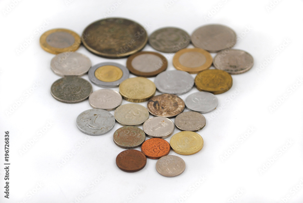 Old and new coins of different countries closeup on white background Old and new coins of different countries closeup on white background