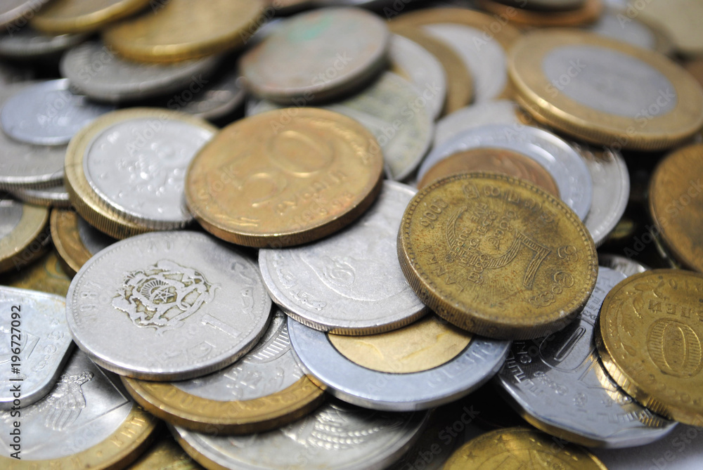 Old and new coins of different countries closeup on white background Old and new coins of different countries closeup on white background
