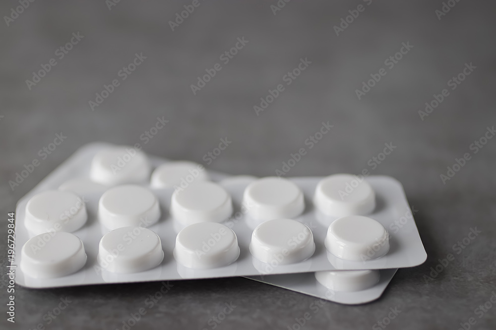 Pills on gray background. Concept of medicine and health. Pills on gray background. Concept of medicine and health.