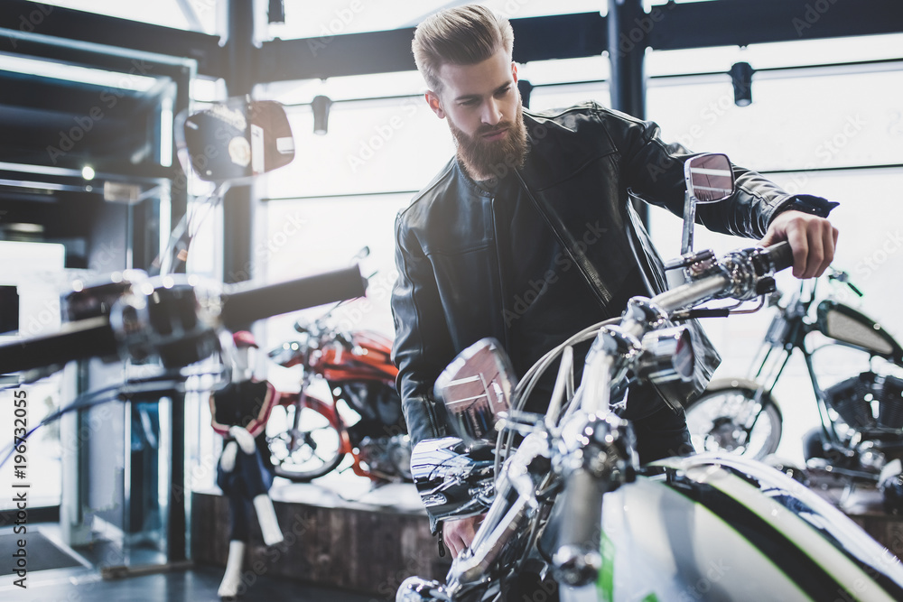 Man in motorcycle shop Man in motorcycle shop
