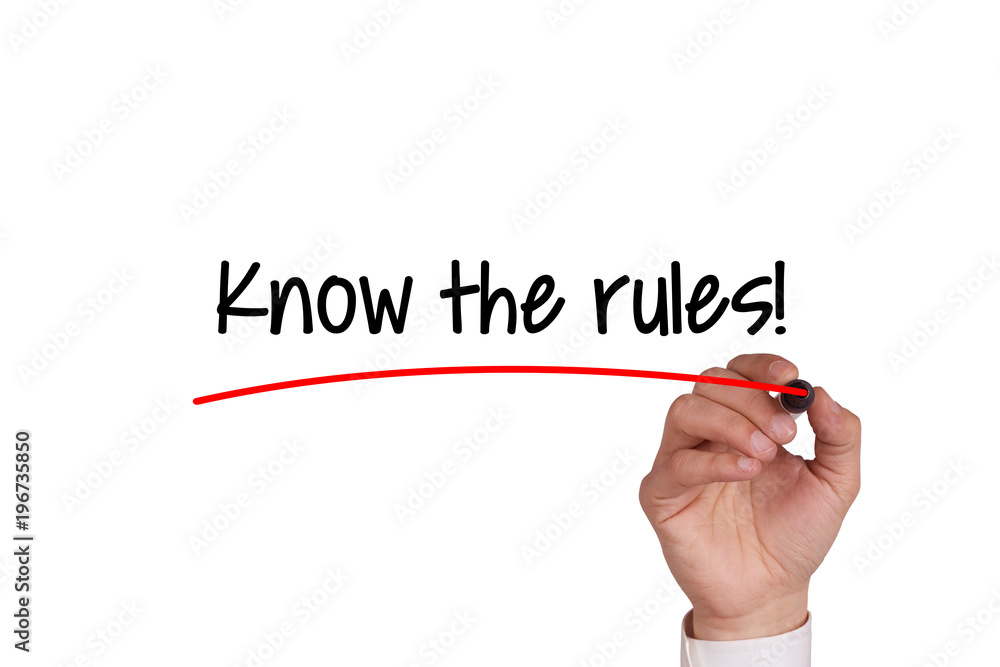 Human hand writing KNOW THE RULES! on whiteboard Human hand writing KNOW THE RULES! on whiteboard