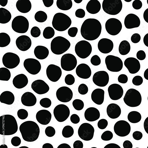Black round spots scattered on white background. Seamless pattern, vector illustration.