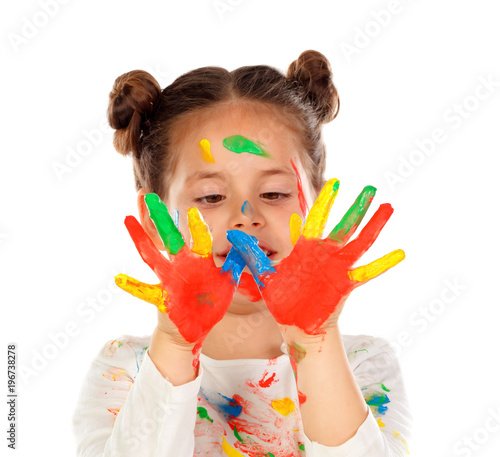 Funny girl with hands and face full of paint